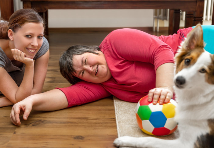 caregivers and a woman smiling