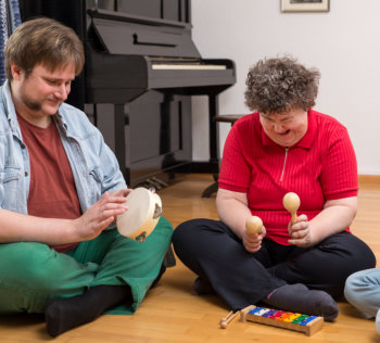 man and woman	playing music
